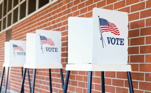 Voting polls set up against a wall.