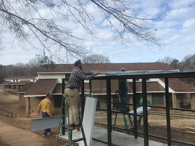 Roof of shelter being put on